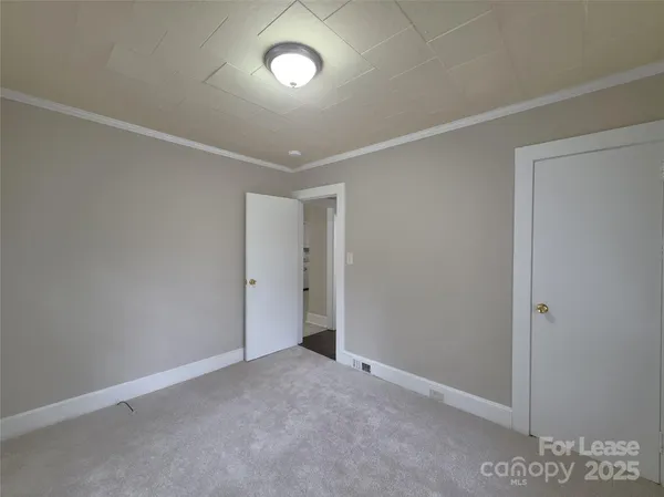 an empty room with a empty space and windows