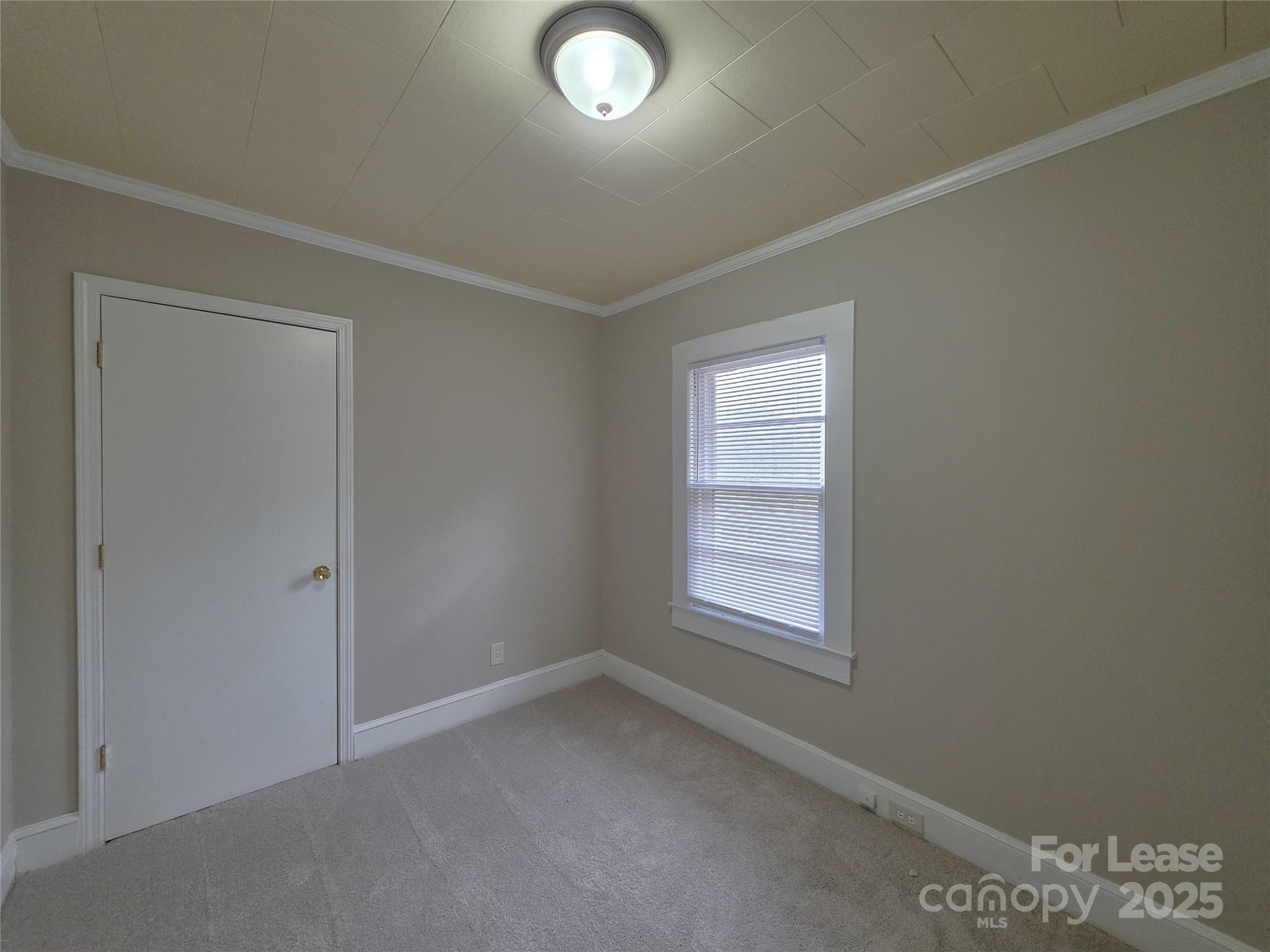 92 Lawndale Avenue Southeast Concord, NC 28025 - Photo 8 of 19 an empty room with windows