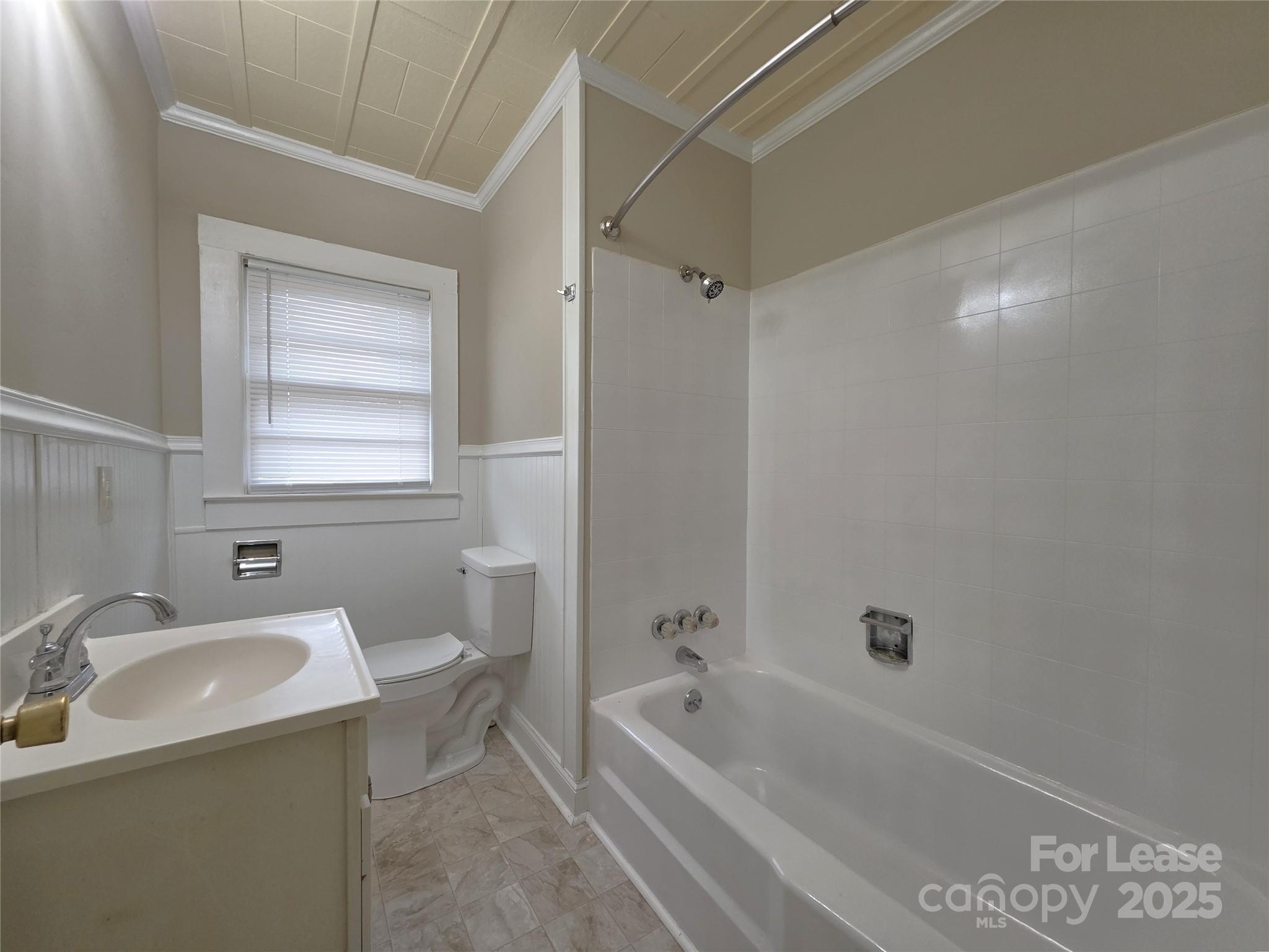92 Lawndale Avenue Southeast Concord, NC 28025 - Photo 10 of 19 a bathroom with a sink a toilet and bathtub