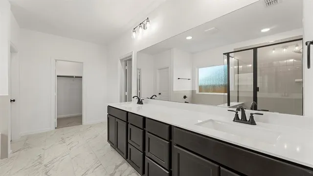 a bathroom with a bathtub and shower