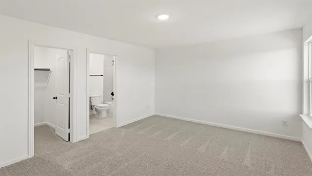 a bathroom with a sink a toilet a mirror a bathtub and shower