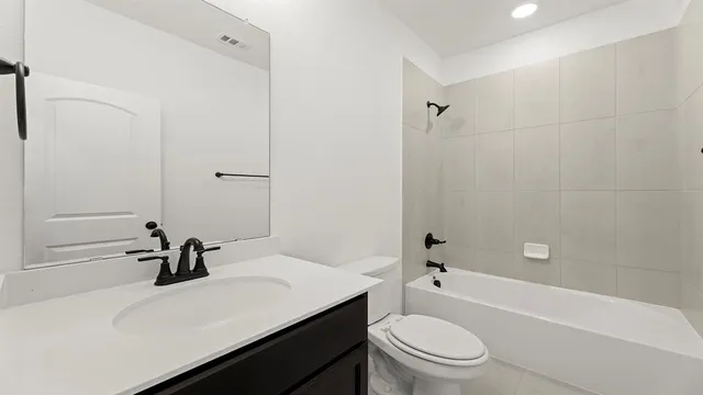 a kitchen with kitchen island a sink stainless steel appliances and cabinets