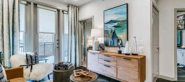 a living room with furniture and a window