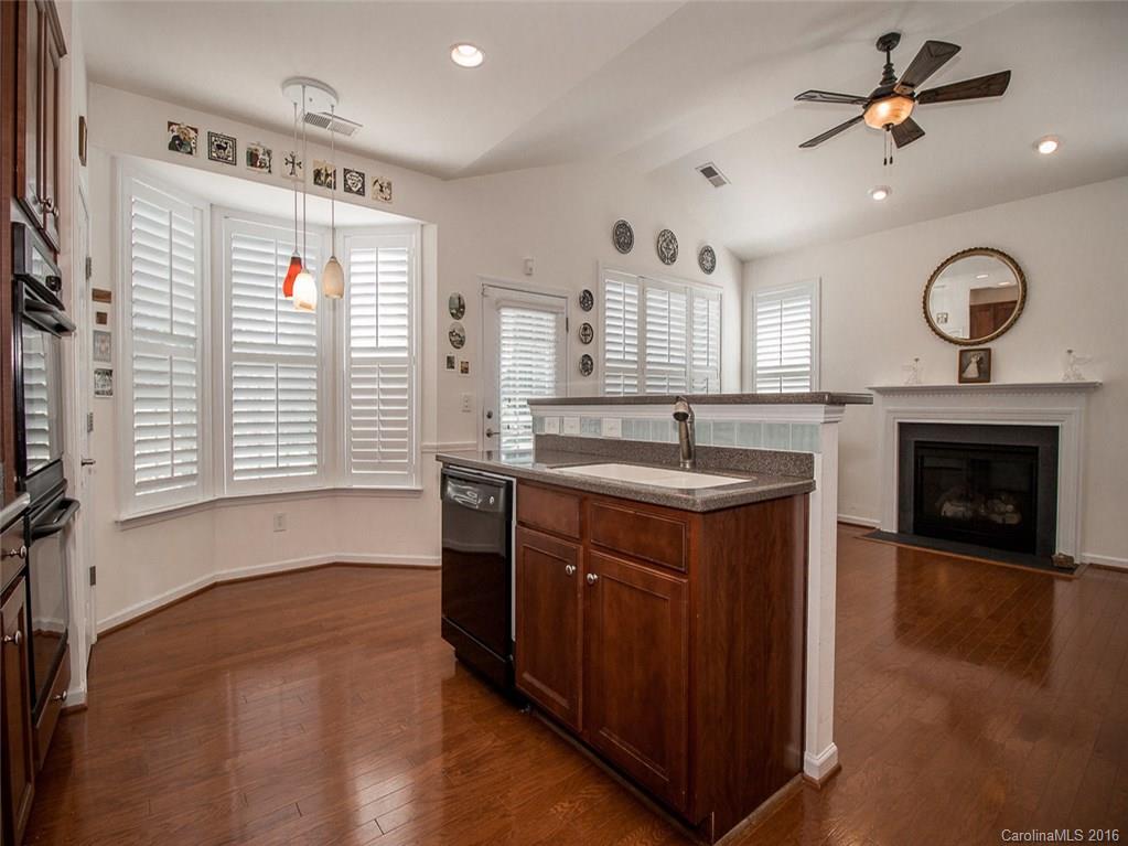 219 Garnet Court, Unit 558 Fort Mill, SC 29708 - Photo 11 of 23 a kitchen with a sink stove and cabinets