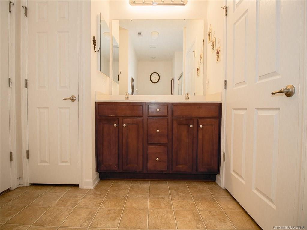 219 Garnet Court, Unit 558 Fort Mill, SC 29708 - Photo 14 of 23 a bathroom with a sink and a mirror