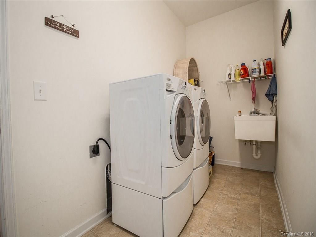 219 Garnet Court, Unit 558 Fort Mill, SC 29708 - Photo 18 of 23 a utility room with dryer and washer