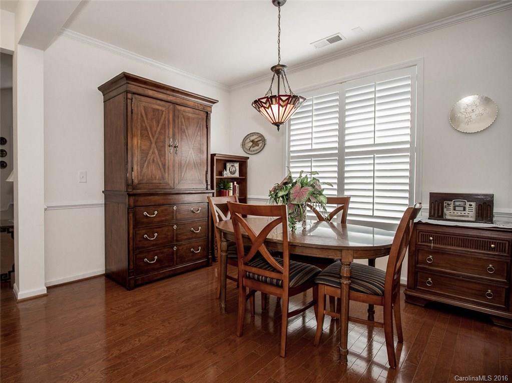 219 Garnet Court, Unit 558 Fort Mill, SC 29708 - Photo 6 of 23 a view of a dining room with furniture window and wooden floor