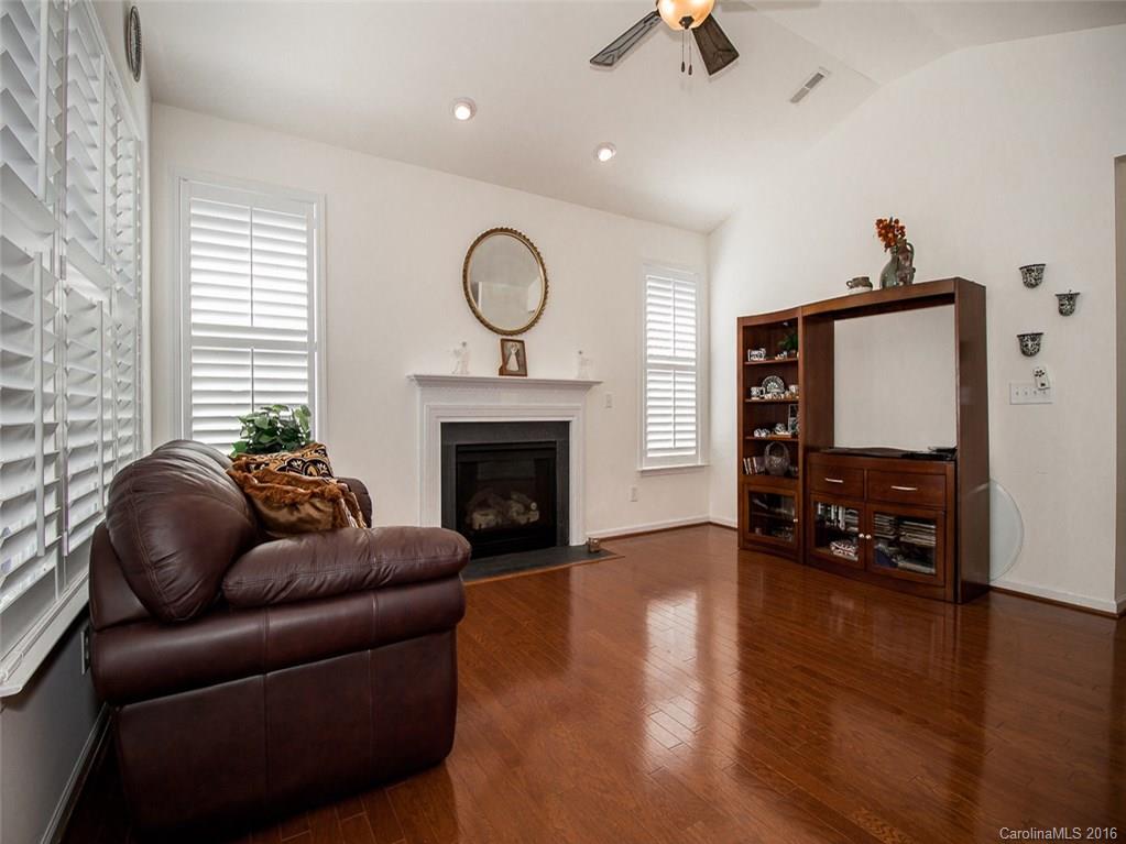 219 Garnet Court, Unit 558 Fort Mill, SC 29708 - Photo 8 of 23 a living room with furniture or fireplace and a flat screen tv