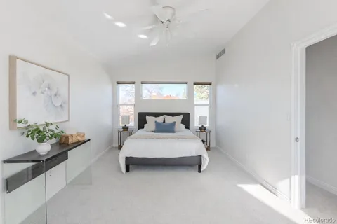 a bed room with a bed and a chandelier