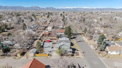 a swimming pool with barbeque oven and outdoor seating