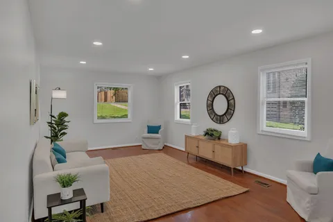 a living room with furniture and a window