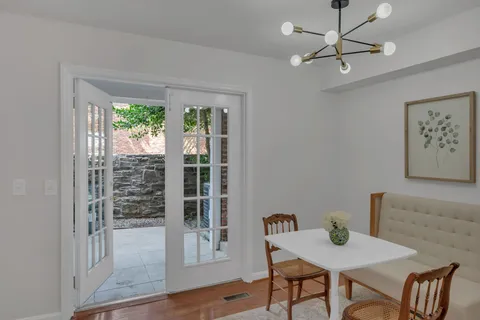 a view of a livingroom with furniture and a window