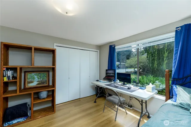 a room with furniture and a large window