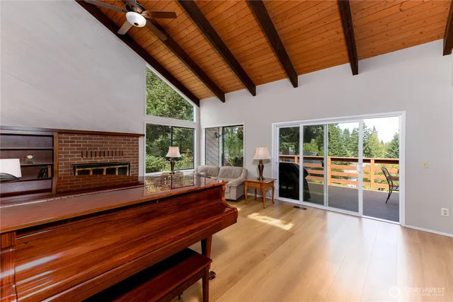 a view of balcony with chairs and wooden fence