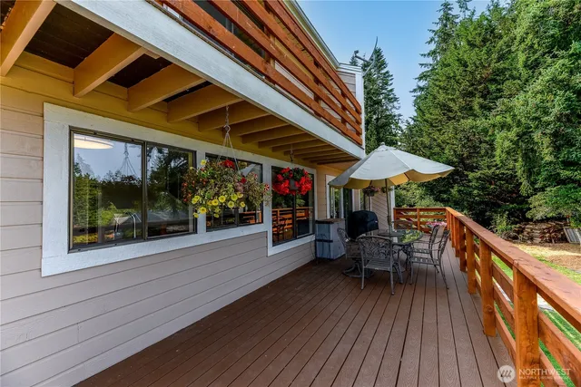 a view of a kitchen with a dining table and chairs