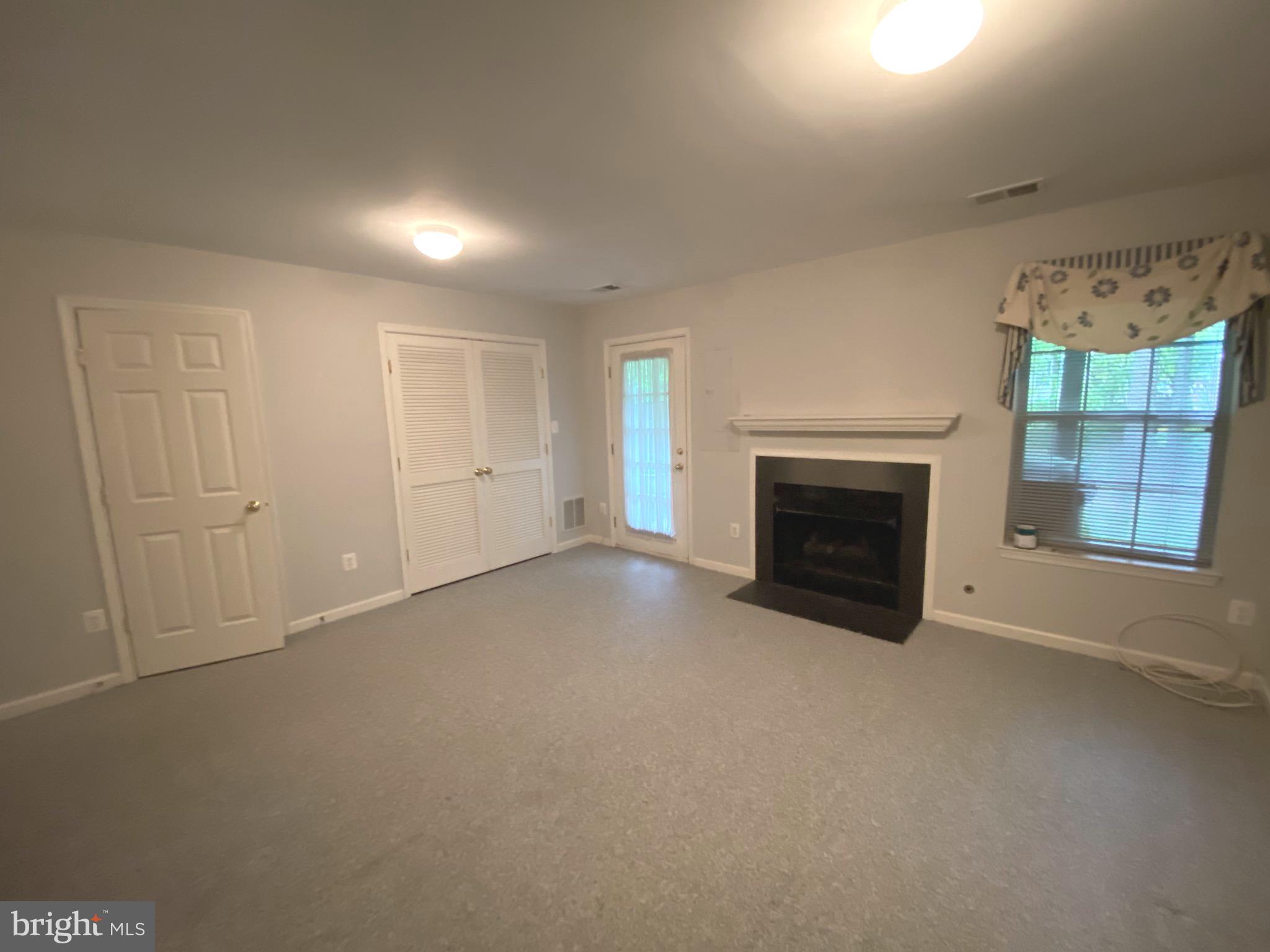 4110 Flower Fairfax, VA 22030 - Photo 19 of 64 a view of empty room with a fireplace and window
