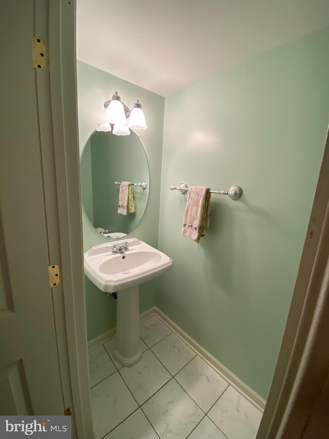 4110 Flower Fairfax, VA 22030 - Photo 20 of 64 a bathroom with a sink a toilet and mirror