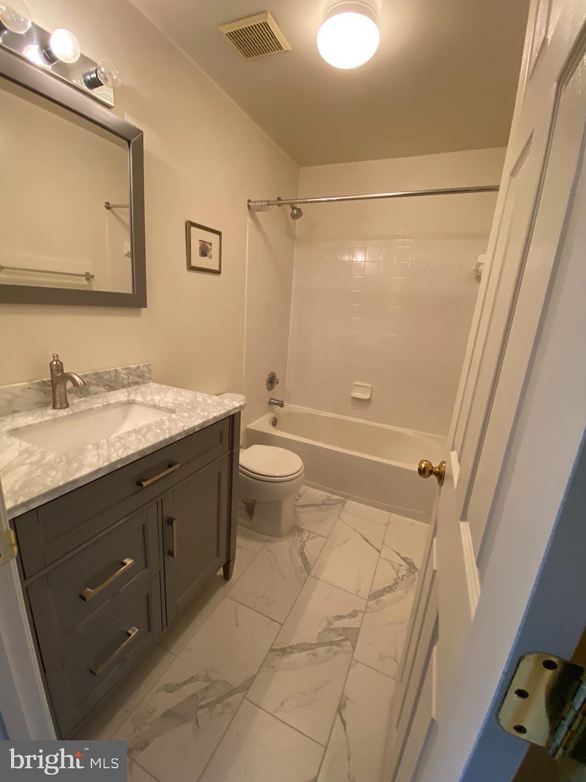 4110 Flower Fairfax, VA 22030 - Photo 28 of 64 a bathroom with a sink a toilet and shower