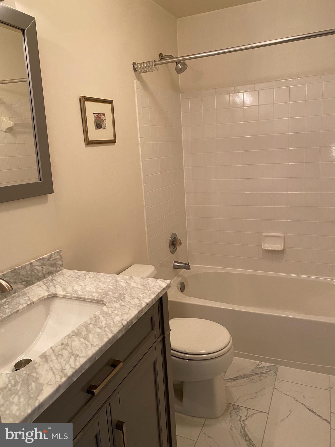 4110 Flower Fairfax, VA 22030 - Photo 29 of 64 a bathroom with a granite countertop bathtub shower sink vanity and toilet