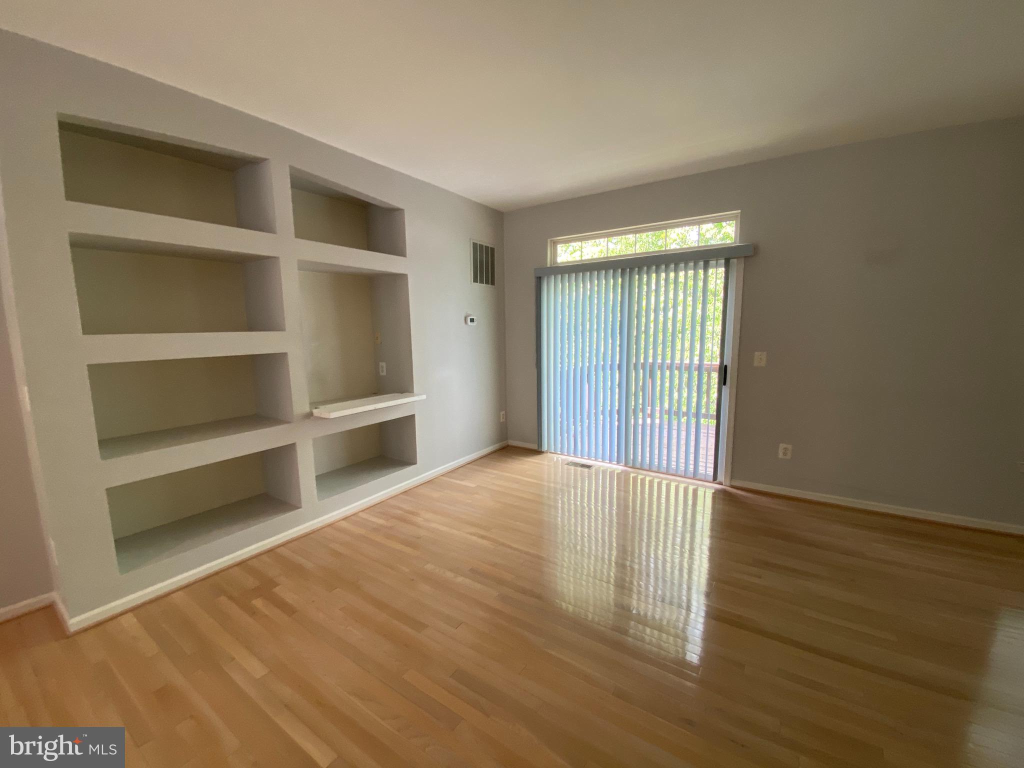 4110 Flower Fairfax, VA 22030 - Photo 3 of 64 a view of an empty room with a window and wooden floor