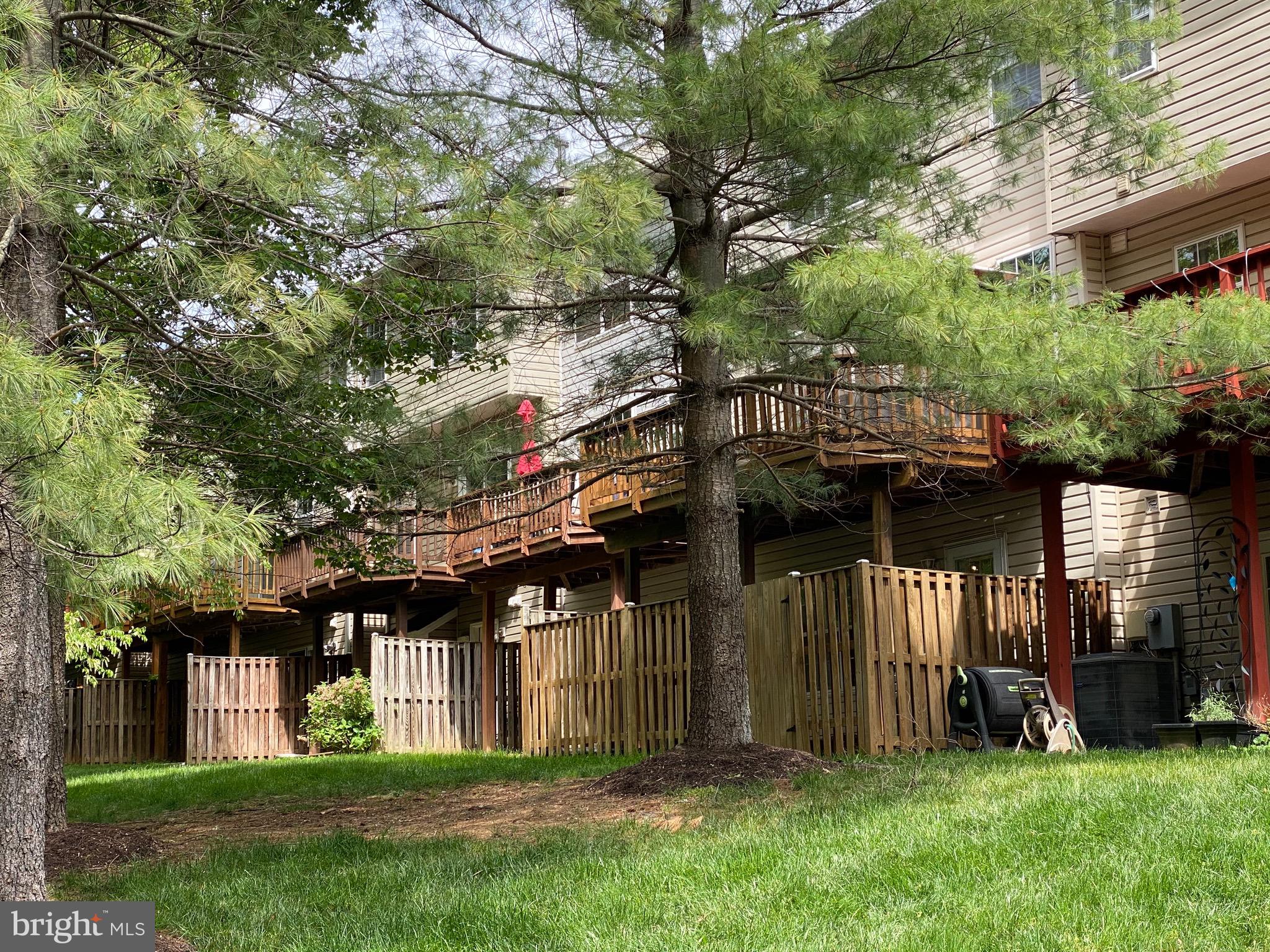 4110 Flower Fairfax, VA 22030 - Photo 32 of 64 a view of a house with a small yard and a large tree