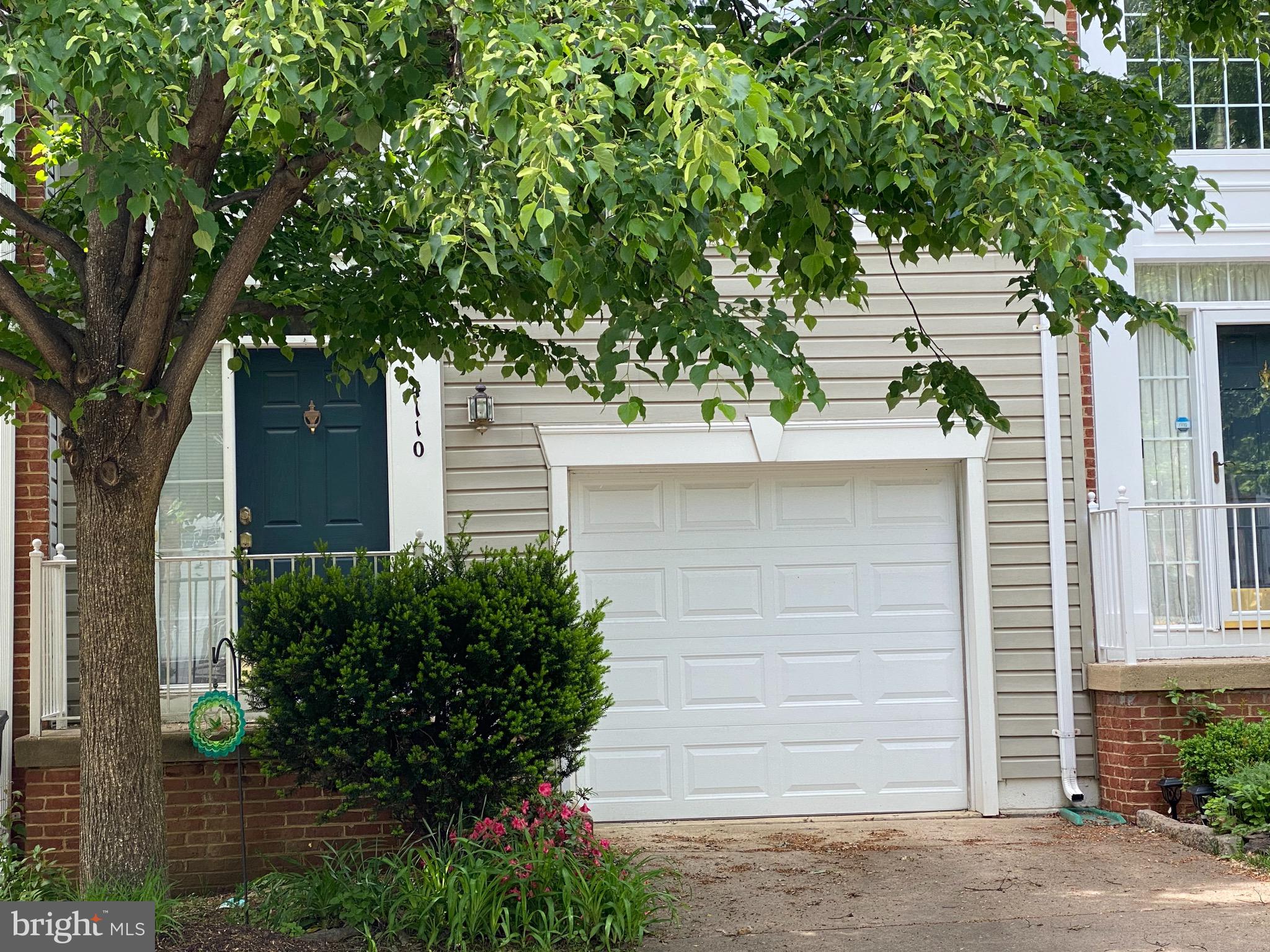 4110 Flower Fairfax, VA 22030 - Photo 33 of 64 a front view of a house with a garden