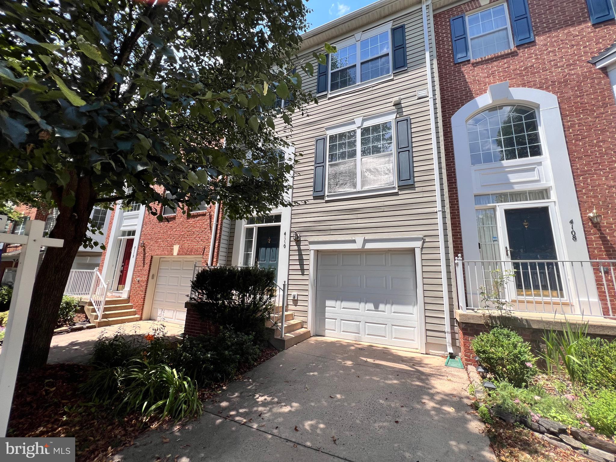 4110 Flower Fairfax, VA 22030 - Photo 36 of 64 a front view of a house with a yard