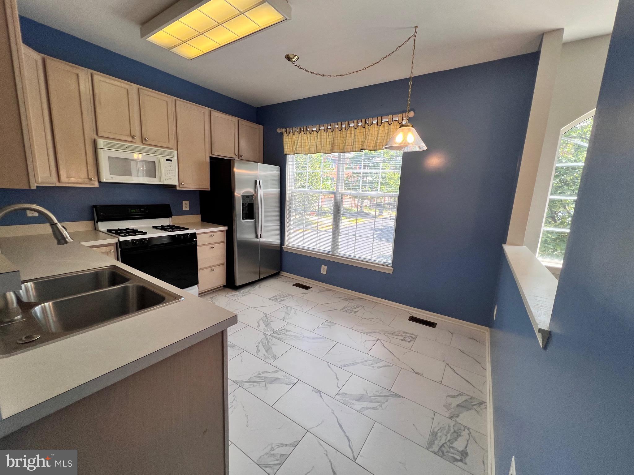 4110 Flower Fairfax, VA 22030 - Photo 38 of 64 a kitchen that has a sink cabinets and a window
