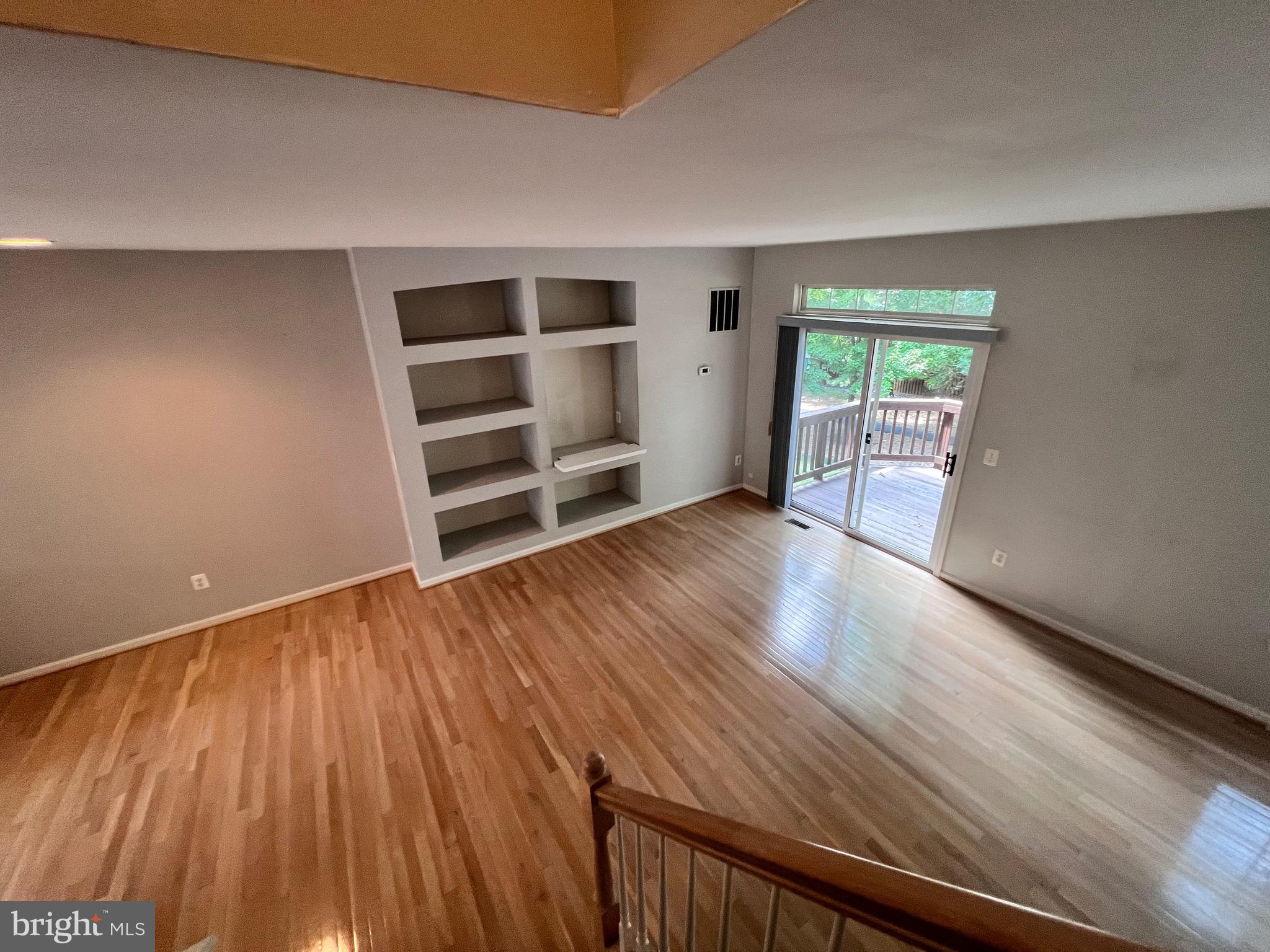 4110 Flower Fairfax, VA 22030 - Photo 41 of 64 a view of an empty room with a window and wooden floor
