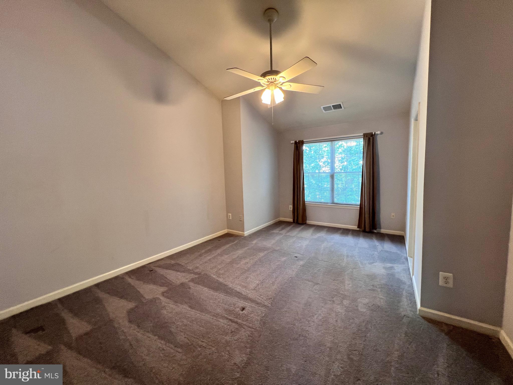 4110 Flower Fairfax, VA 22030 - Photo 50 of 64 a view of an empty room with window and chandelier fan
