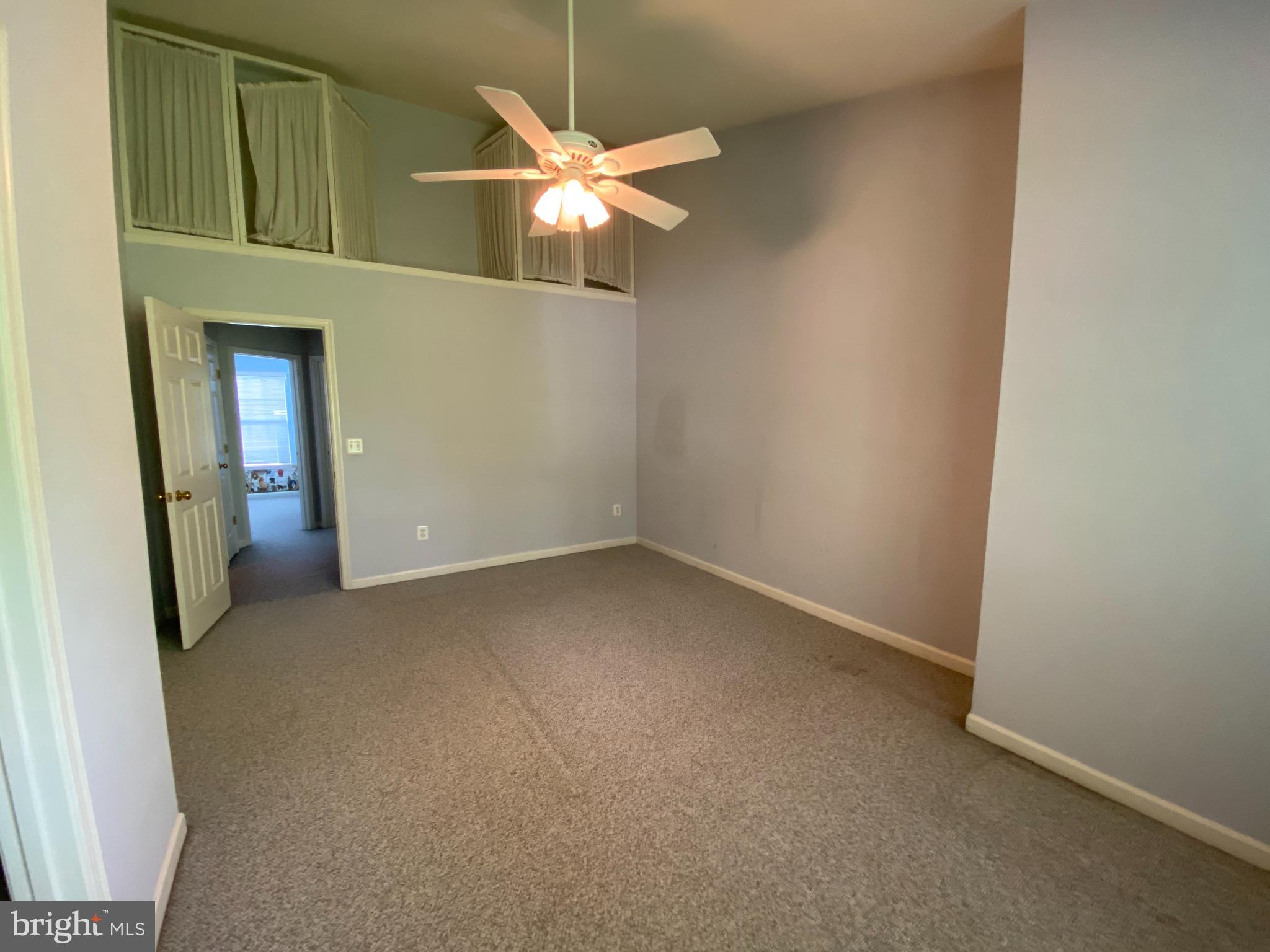 4110 Flower Fairfax, VA 22030 - Photo 5 of 64 an empty room with a chandelier fan and a bathroom