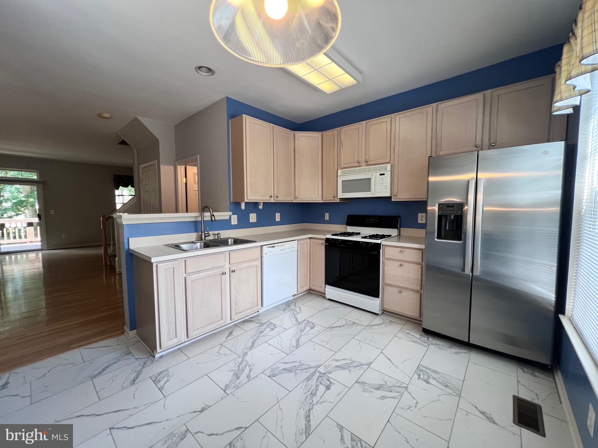 4110 Flower Fairfax, VA 22030 - Photo 54 of 64 a kitchen with granite countertop a refrigerator sink and cabinets