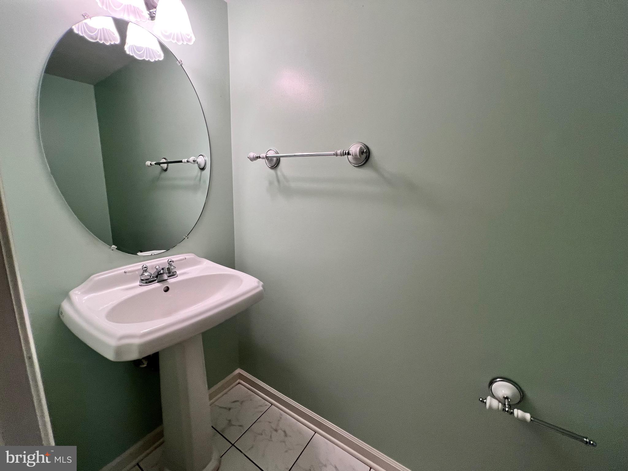 4110 Flower Fairfax, VA 22030 - Photo 59 of 64 a bathroom with a sink and mirror