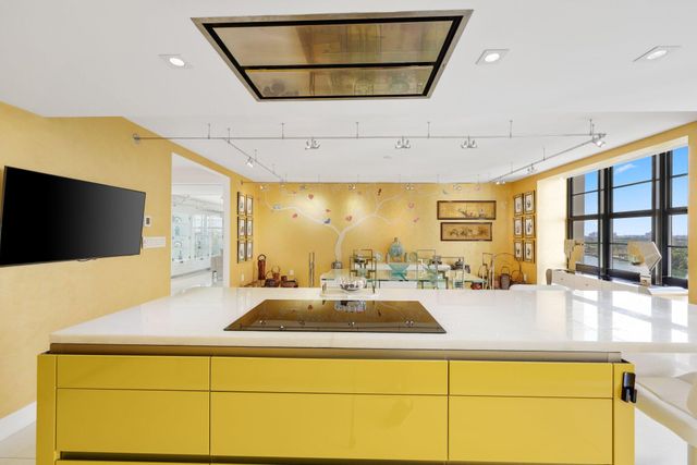 a bathroom with a toilet sink vanity and mirror