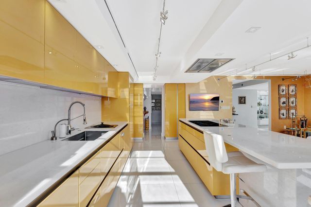 a terrace with outdoor seating city view and lake view