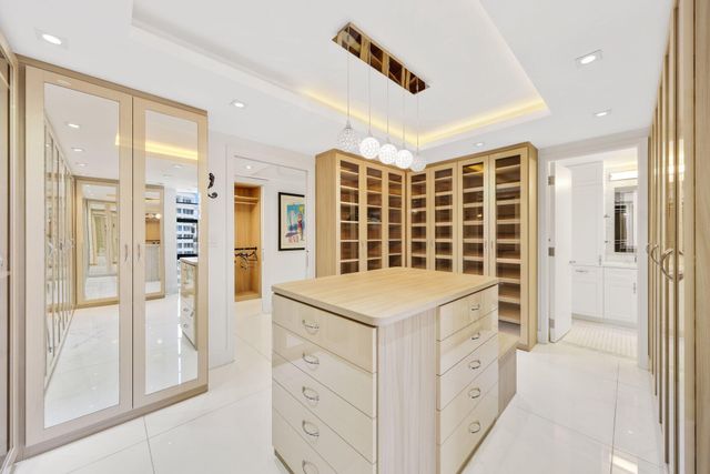 an aerial view of a house with garden space and trees