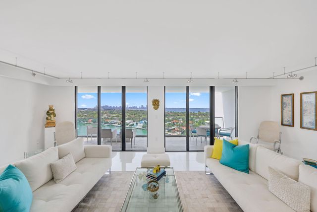 a large kitchen with a table and chairs
