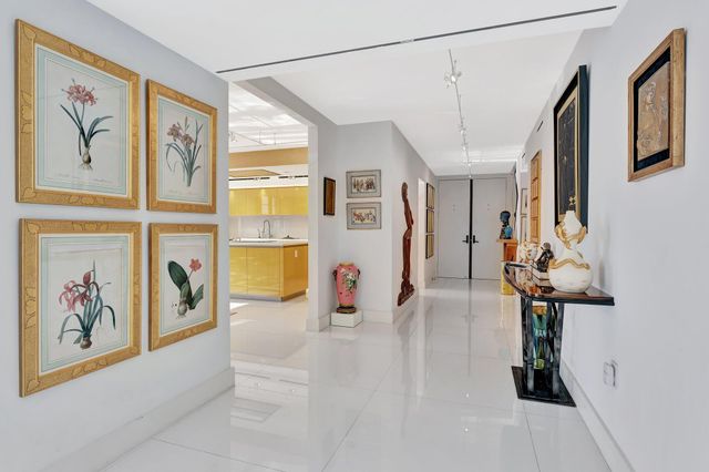 a bathroom with a double vanity sink toilet and shower