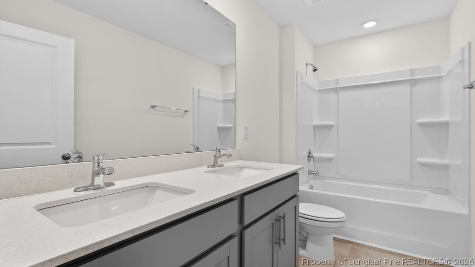 115 Discovery Way Spring Lake, NC 28390 - Photo 22 of 30 a bathroom with a sink double vanity granite toilet tub and shower