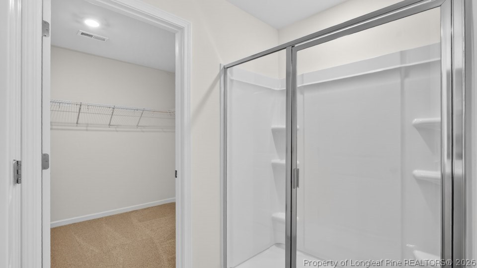 115 Discovery Way Spring Lake, NC 28390 - Photo 25 of 30 a bathroom with a glass shower door