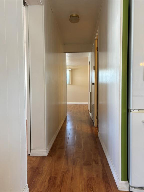 13225 101st Street Southeast, Unit 144 Largo, FL 33773 - Photo 12 of 33 a view of a hallway with wooden floor