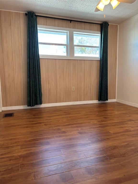 13225 101st Street Southeast, Unit 144 Largo, FL 33773 - Photo 13 of 33 a view of a room with wooden floor and a window