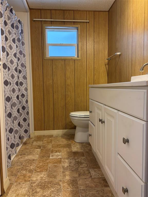 13225 101st Street Southeast, Unit 144 Largo, FL 33773 - Photo 16 of 33 a bathroom with a sink a toilet and shower