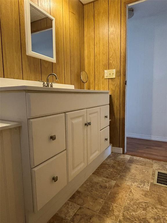 13225 101st Street Southeast, Unit 144 Largo, FL 33773 - Photo 17 of 33 a bathroom with a sink and a mirror