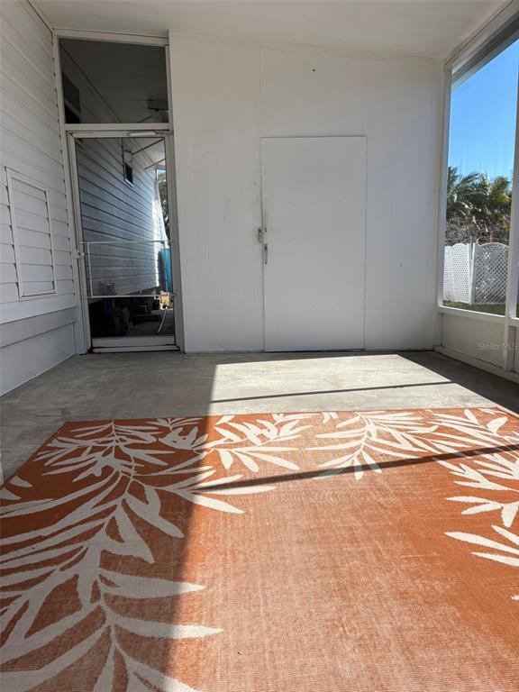 13225 101st Street Southeast, Unit 144 Largo, FL 33773 - Photo 24 of 33 a view of a livingroom with wooden floor and a cabinet