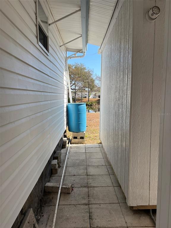 13225 101st Street Southeast, Unit 144 Largo, FL 33773 - Photo 26 of 33 a view of balcony with wooden floor and seating space
