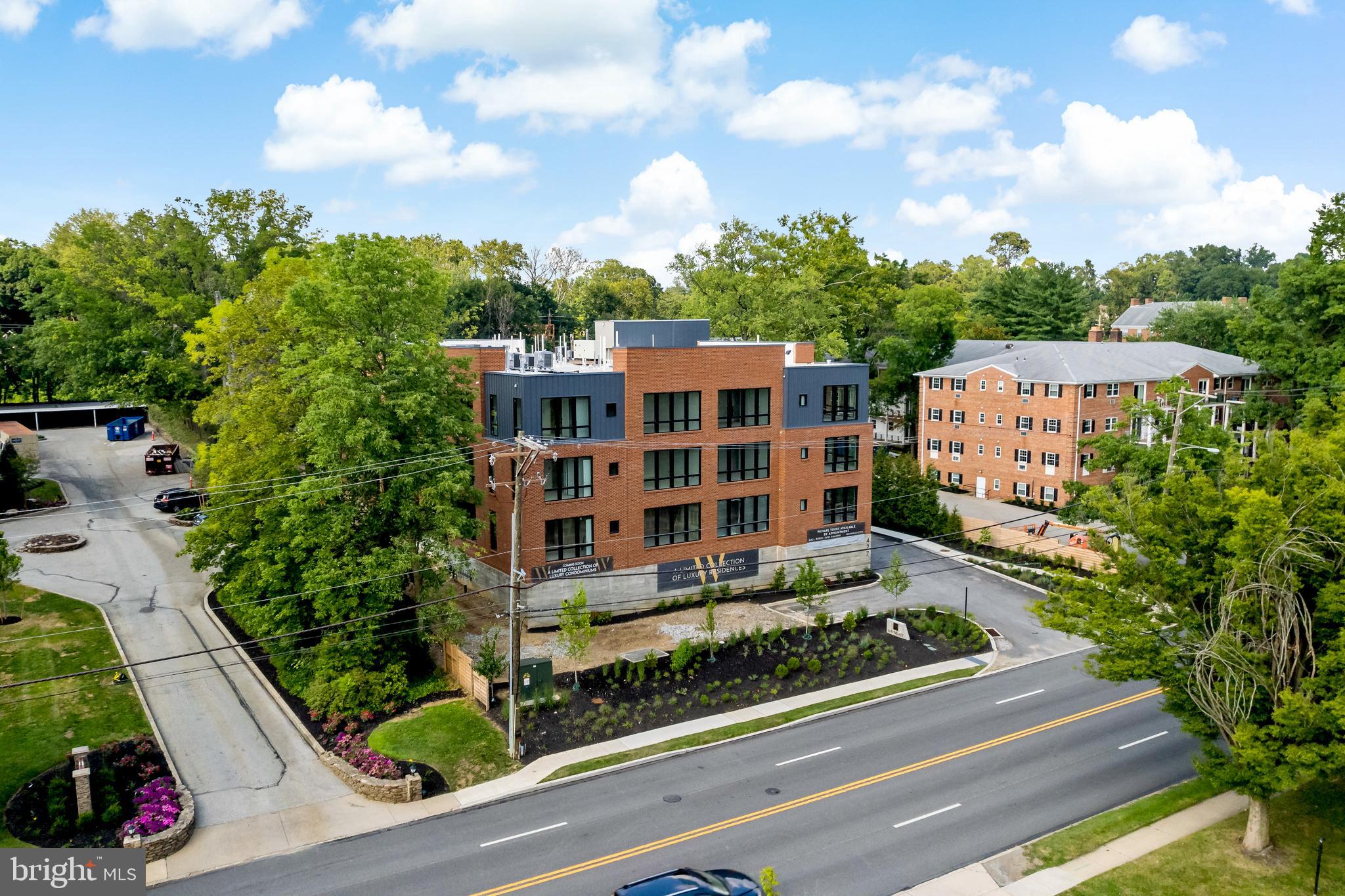 427 Lancaster Avenue, Unit B201 Wayne, PA 19087 - Photo 11 of 18 a view of a city that has tall buildings