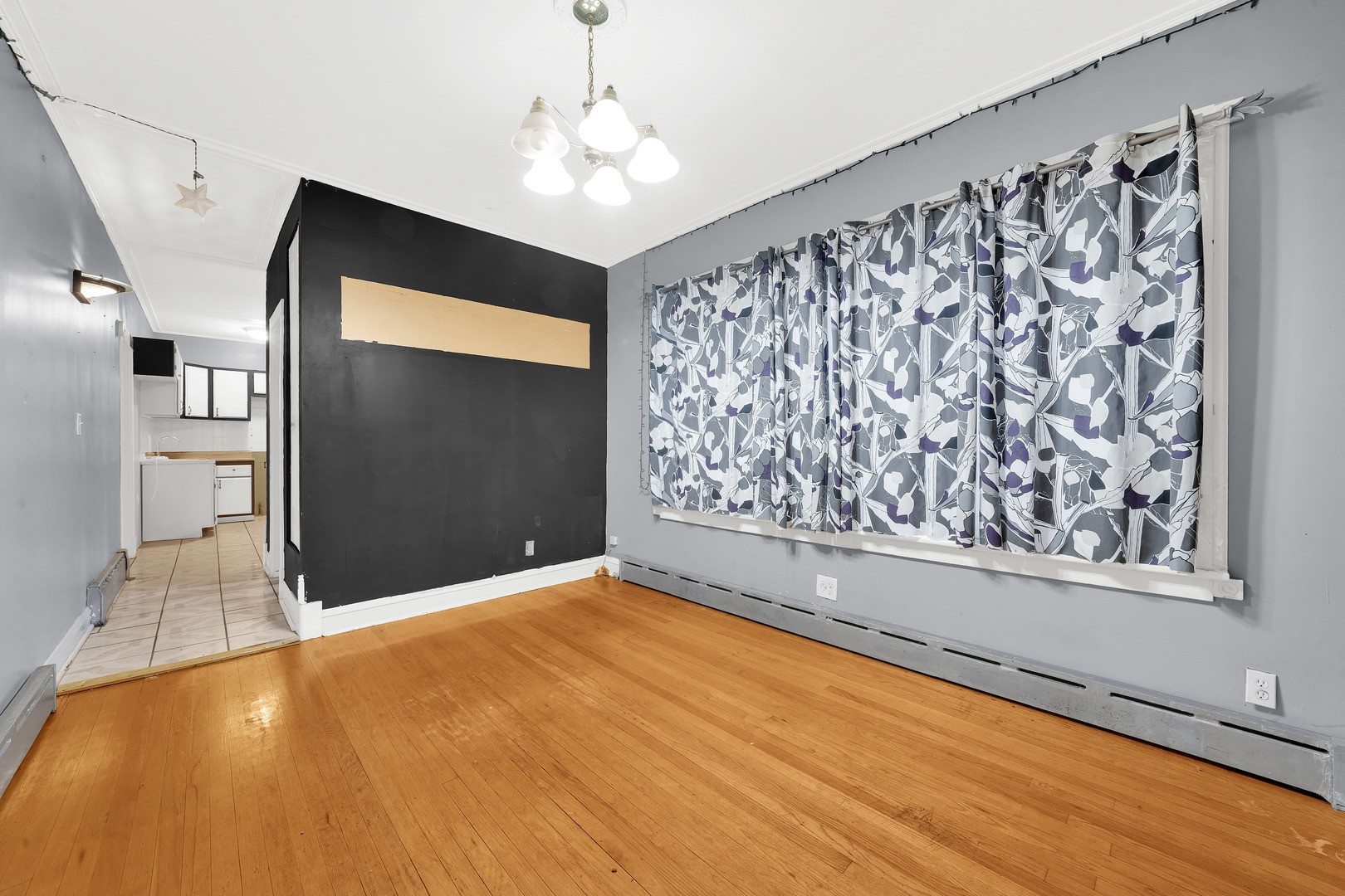2547 West 51st Street Chicago, IL 60632 - Photo 15 of 19 a view of empty room with window and ceiling fan