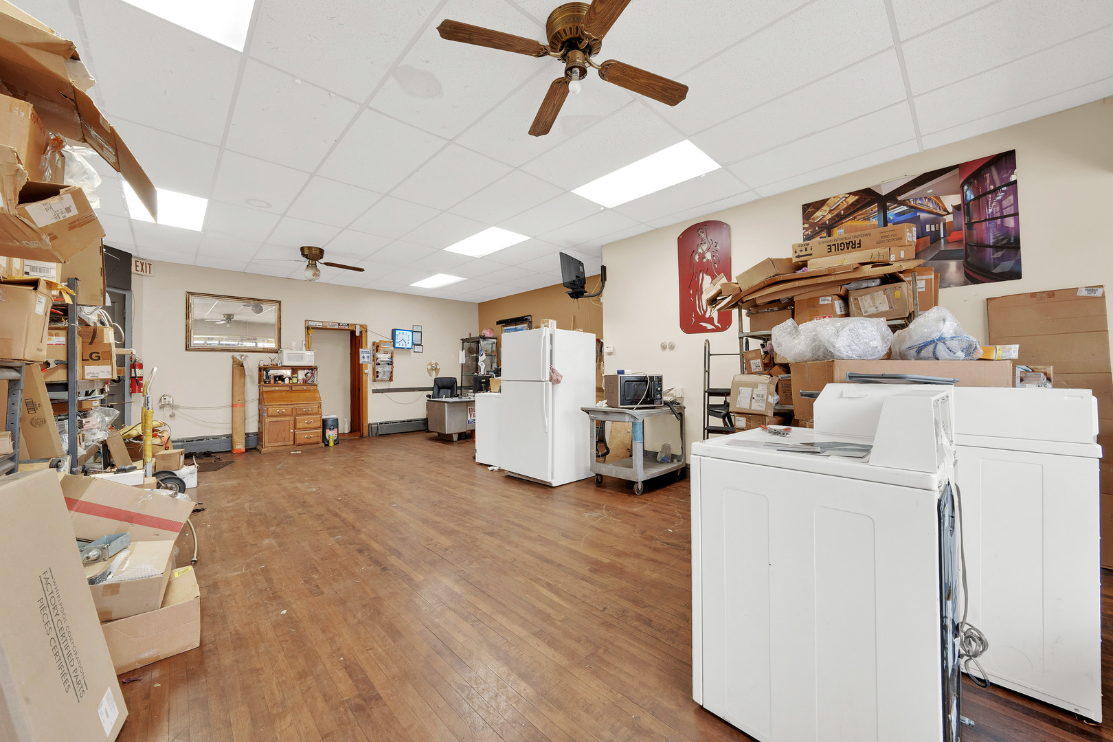 2547 West 51st Street Chicago, IL 60632 - Photo 4 of 19 a view of a room with gym equipment and refrigerator