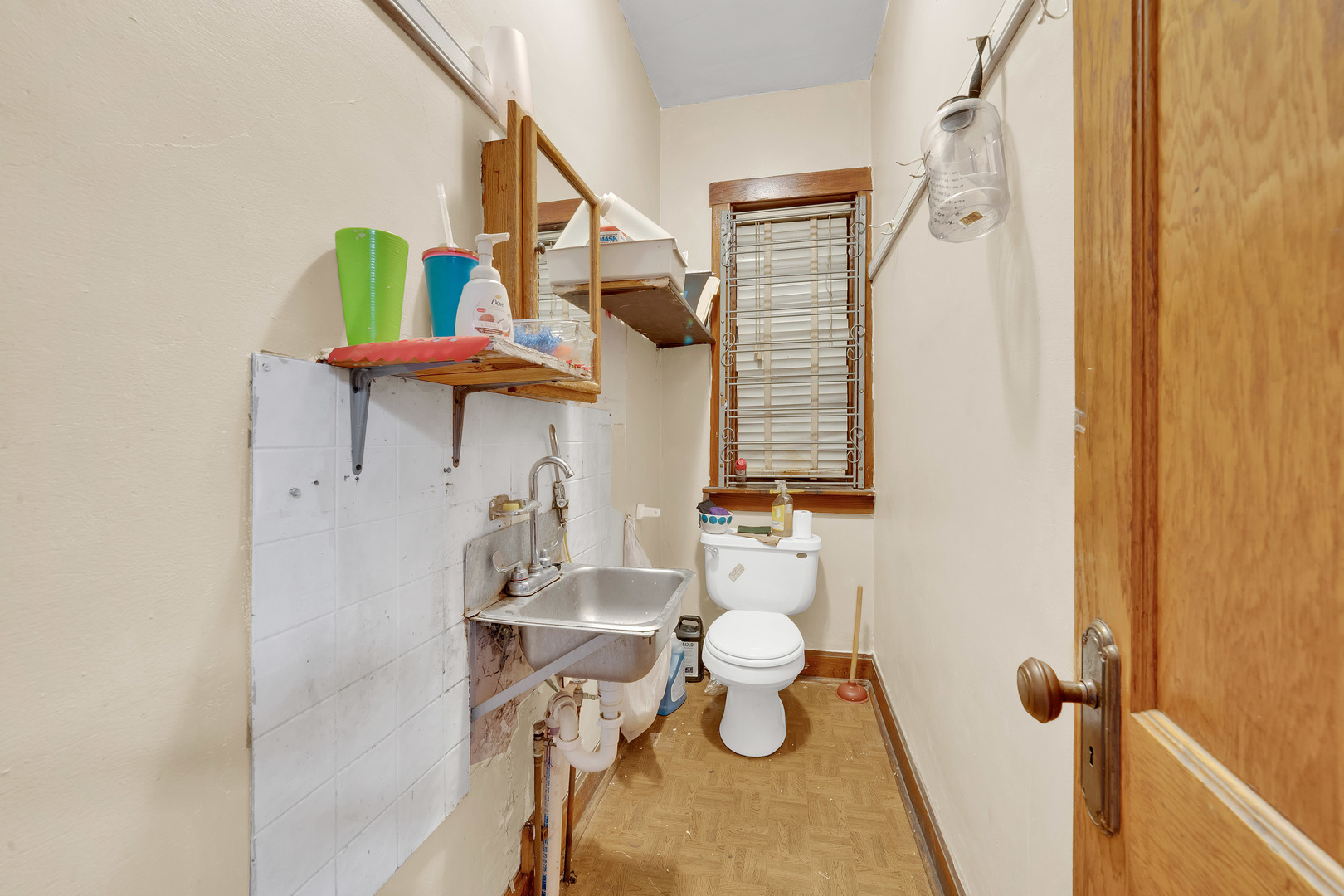 2547 West 51st Street Chicago, IL 60632 - Photo 7 of 19 a bathroom with a sink toilet and shower